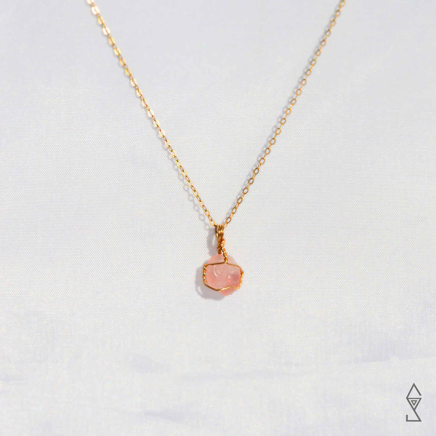 Rose Quartz Crystal Necklace in 14K gold for self love and compassion. Discover the Rose Quartz Jewelry Meaning.