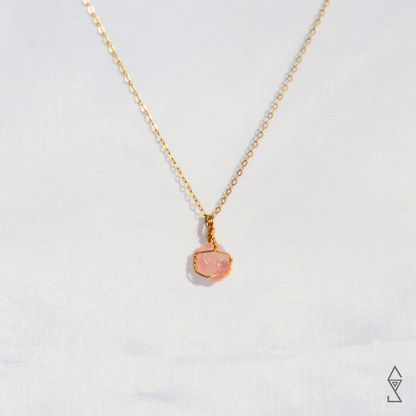 Rose Quartz Crystal Necklace in 14K gold for self love and compassion. Discover the Rose Quartz Jewelry Meaning.