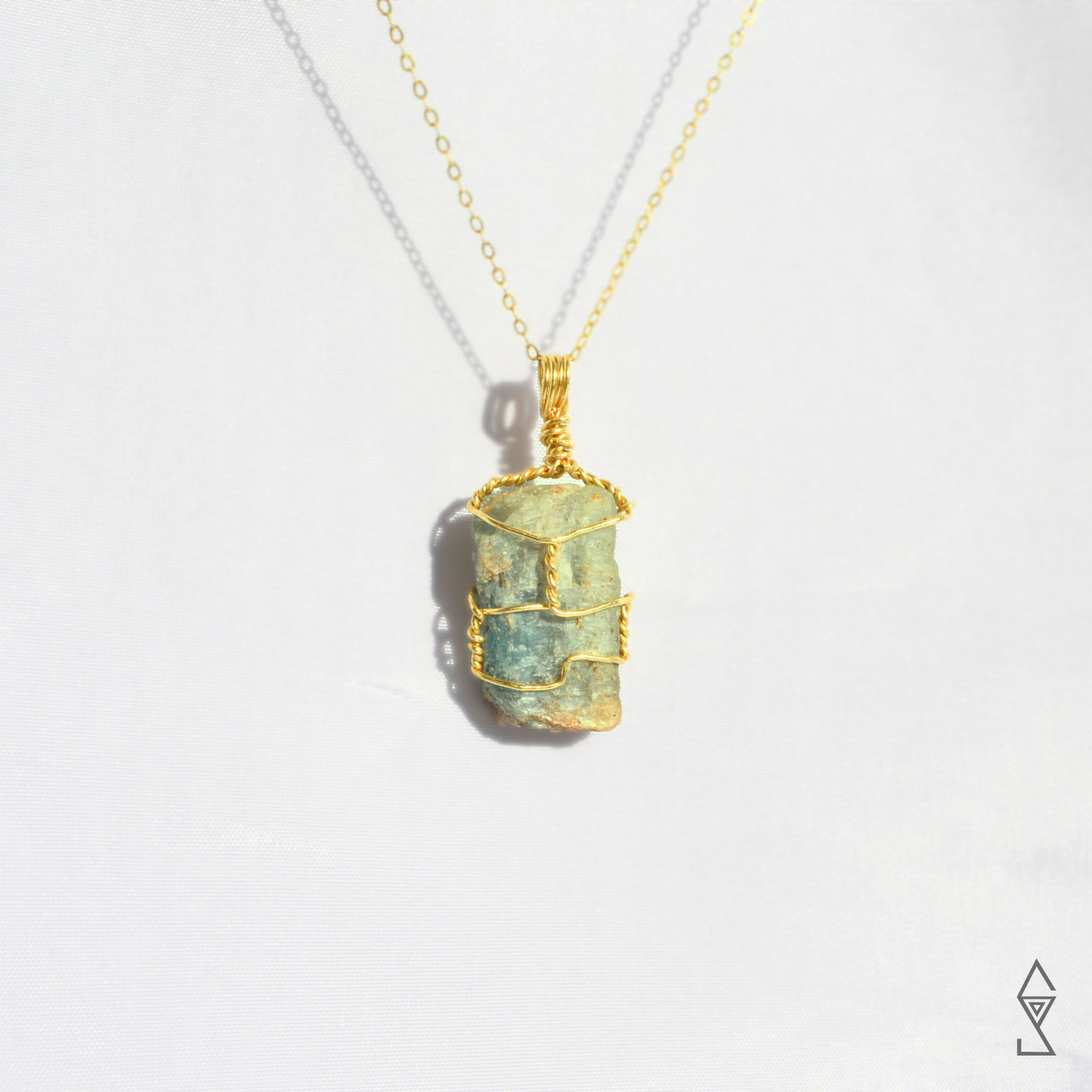 gold crystal jewelry handmade in Australia featuring blue green kyanite natural crystals