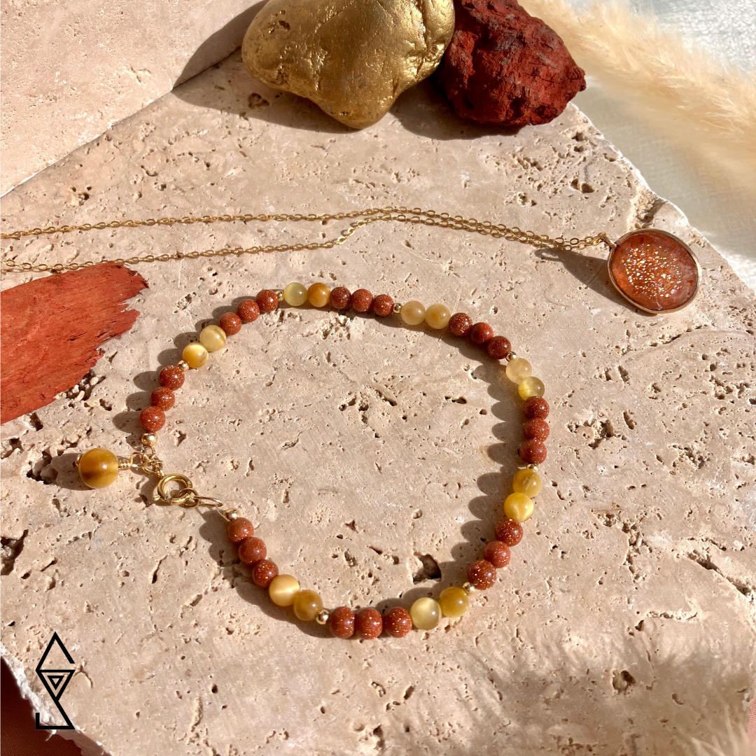 Tigers eye, sunstone and goldstone crystal jewelry and the meaning of sunstone and goldstone in crystal properties