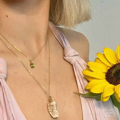 Peridot Crystal necklace paired with peach selenite. Shop Healing Crystal Jewelry Australia